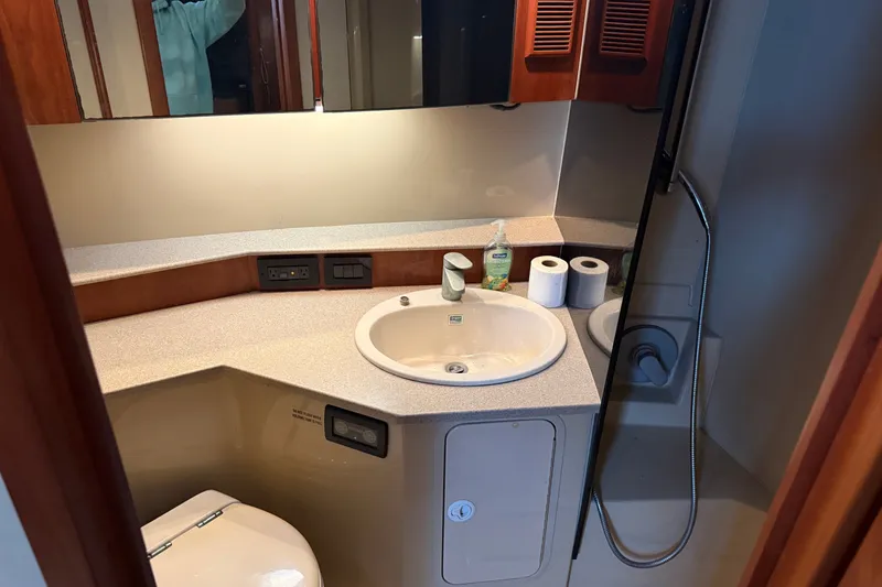 Slide: The Image of Bathroom interior of 2006 Rampage 38 Express yacht with sink and shower. - 16