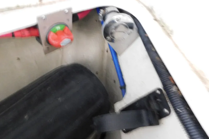 Slide: The Image of 2004 Regal Commodore 3860 boat compartment with battery switch and wiring. - 108
