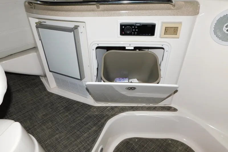 Slide: The Image of 2004 Regal Commodore 3860 yacht interior with mini fridge and storage compartment. - 32