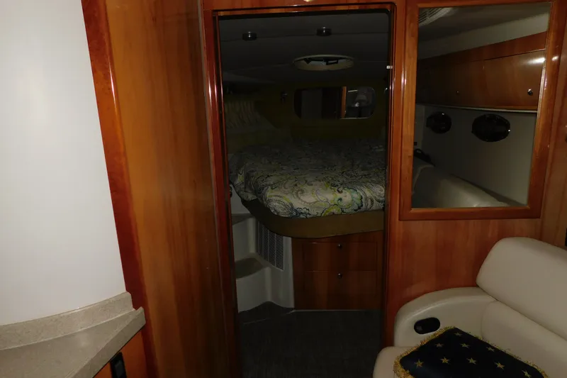Slide: The Image of Interior cabin of 2004 Regal Commodore 3860 yacht with bed and seating area. - 59