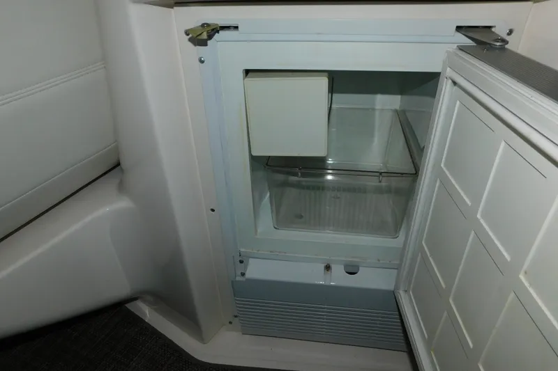 Slide: The Image of Open refrigerator inside 2004 Regal Commodore 3860 boat cabin. - 34