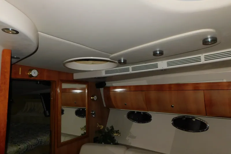 Slide: The Image of Interior of 2004 Regal Commodore 3860 yacht with wood cabinetry and modern lighting. - 96