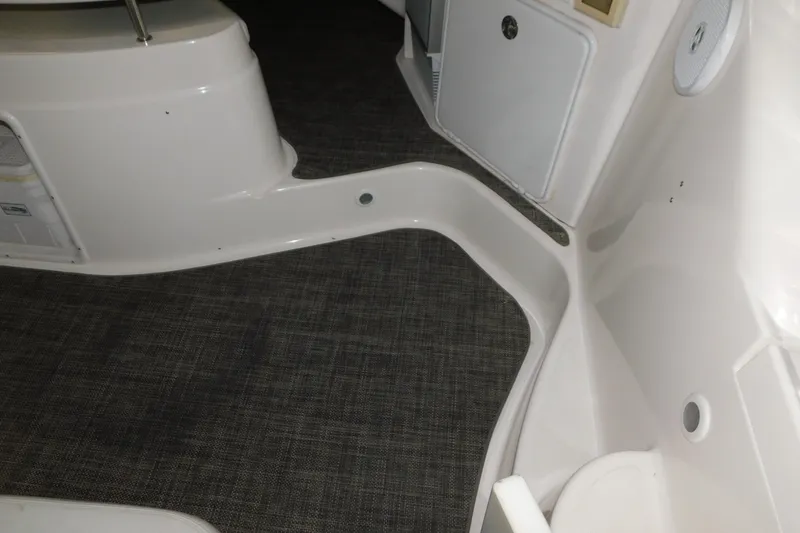 Slide: The Image of Interior view of a 2004 Regal Commodore 3860 boat with carpeted flooring. - 25
