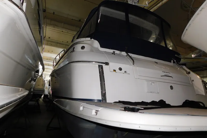 Slide: The Image of 2004 Regal Commodore 3860 yacht in storage, rear view with covered cockpit. - 7
