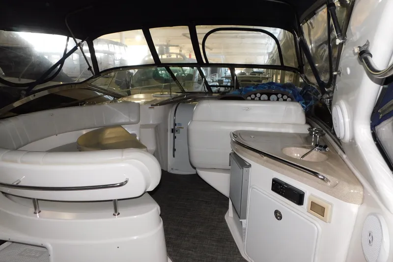 Slide: The Image of Interior of 2004 Regal Commodore 3860 yacht with seating and kitchenette. - 26