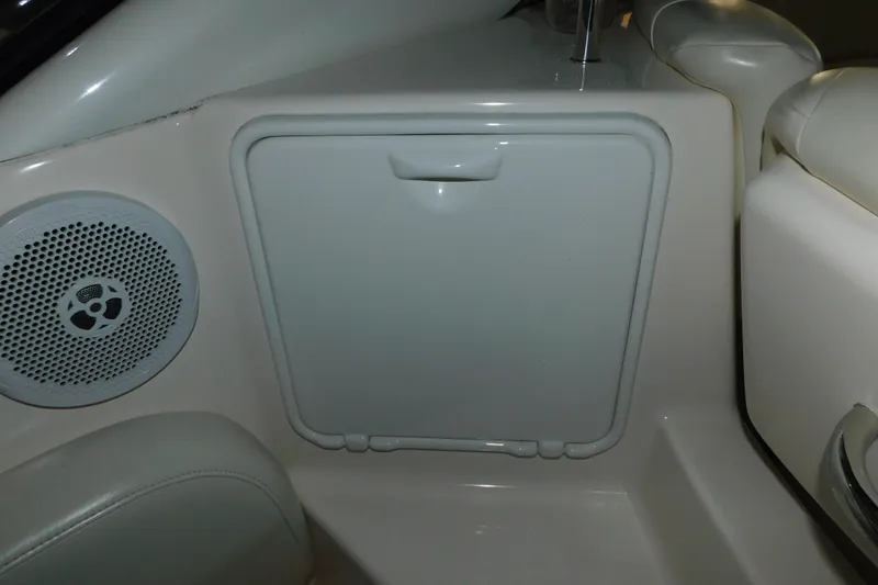 Slide: The Image of 2004 Regal Commodore 3860 interior with speaker and storage compartment. - 28