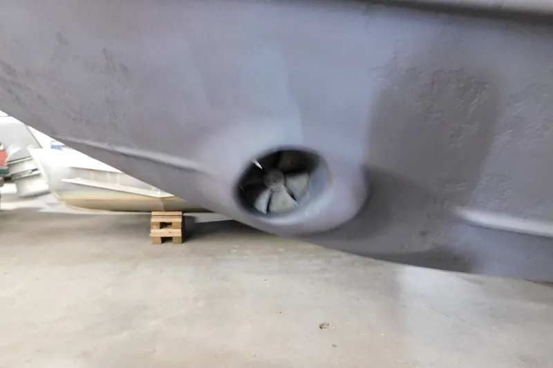 Slide: The Image of Close-up of a 2004 Regal Commodore 3860 boat's bow thruster in a workshop. - 10