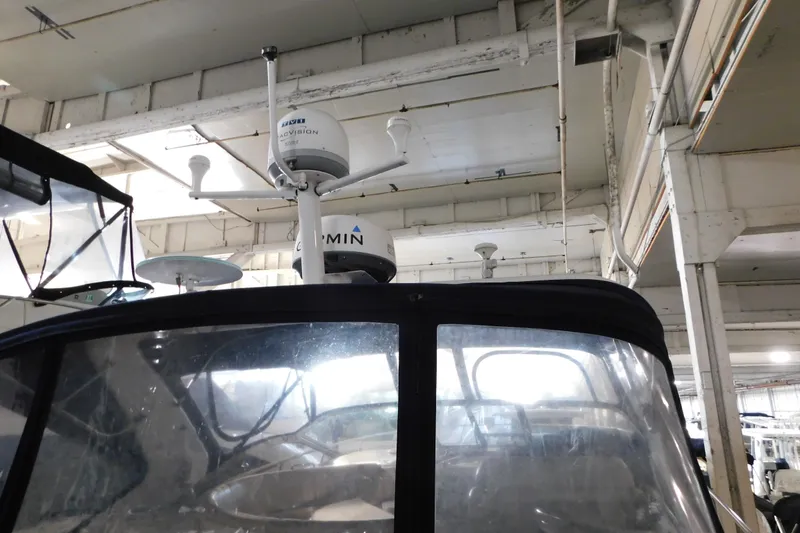 Slide: The Image of 2004 Regal Commodore 3860 boat with radar equipment in a storage facility. - 23