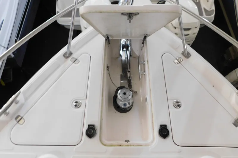 Slide: The Image of 2004 Regal Commodore 3860 boat anchor compartment with open hatch and winch system. - 105