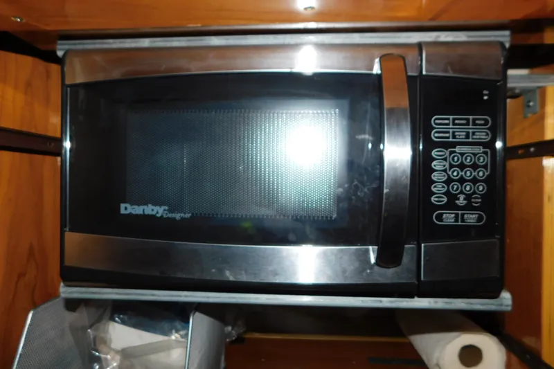 Slide: The Image of Danby Designer microwave in a 2004 Regal Commodore 3860 yacht kitchen. - 84