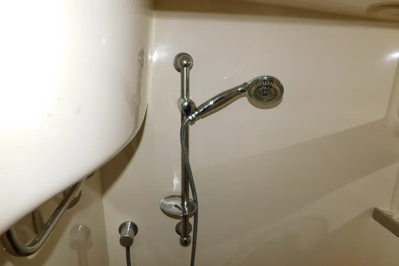 Slide: The Image of Shower area in 2004 Regal Commodore 3860 yacht with chrome fixtures. - 93
