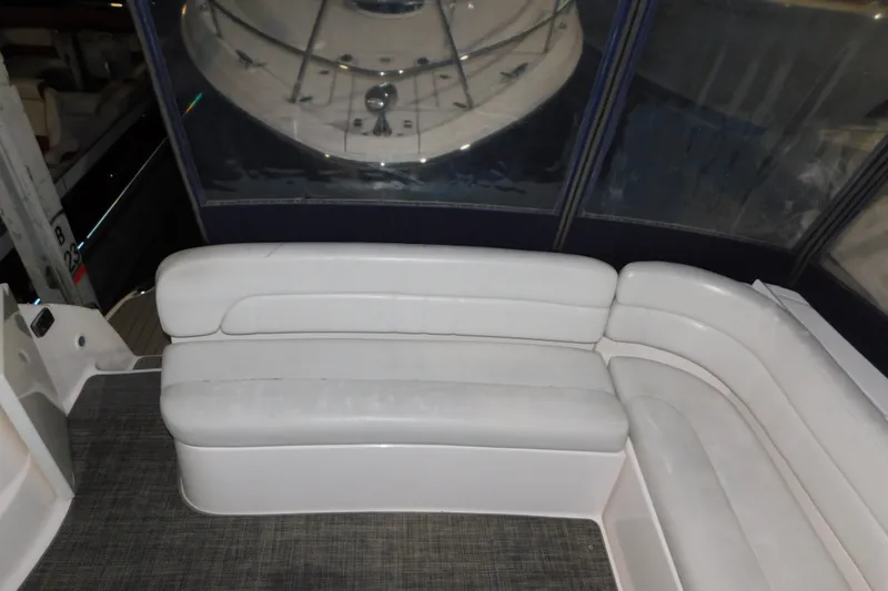 Slide: The Image of 2004 Regal Commodore 3860 yacht interior with white seating and carpeted floor. - 49