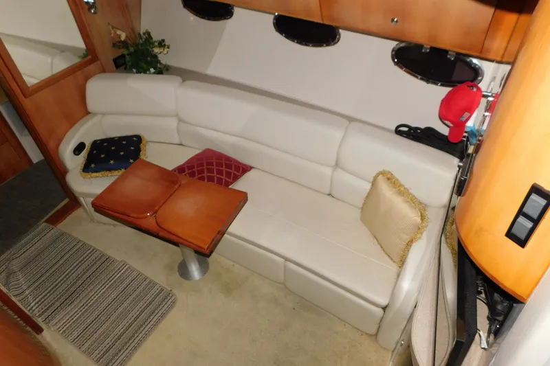 Slide: The Image of Luxurious interior of 2004 Regal Commodore 3860 yacht with plush seating and elegant decor. - 52