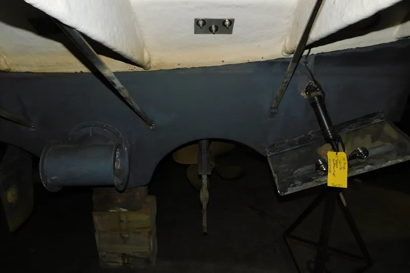 Slide: The Image of 2004 Regal Commodore 3860 boat underside with propeller and support structures. - 3