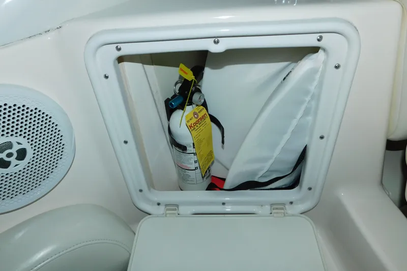 Slide: The Image of Fire extinguisher and life jacket storage on 2004 Regal Commodore 3860 boat. - 29