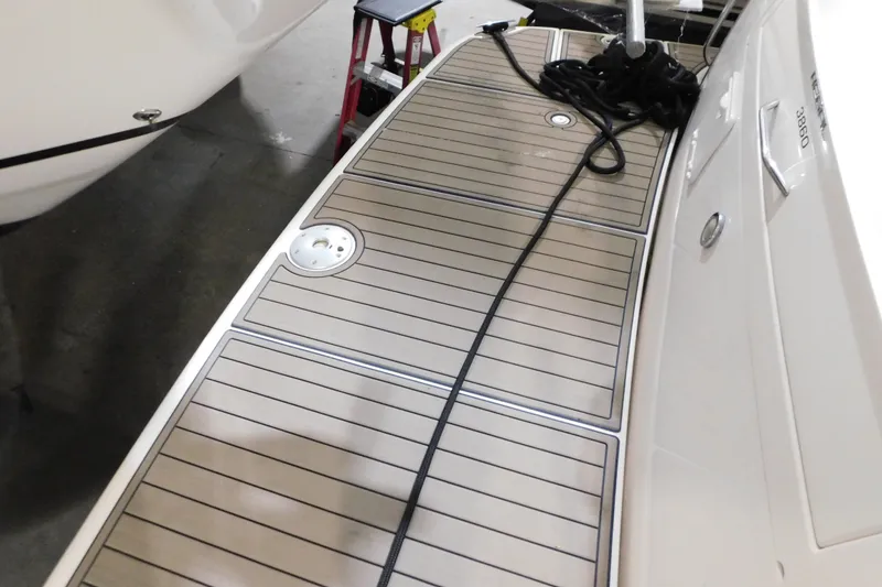 Slide: The Image of 2004 Regal Commodore 3860 swim platform with teak decking and mooring line. - 19
