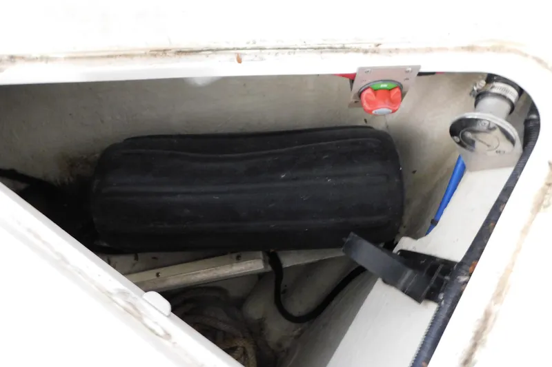 Slide: The Image of 2004 Regal Commodore 3860 boat storage compartment with equipment and controls. - 107