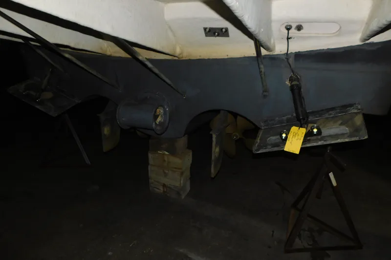 Slide: The Image of 2004 Regal Commodore 3860 boat underside with propellers and supports. - 2