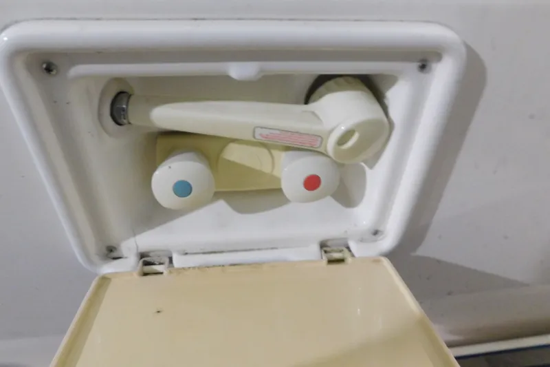 Slide: The Image of Outdoor shower controls on a 2004 Regal Commodore 3860 boat. - 18