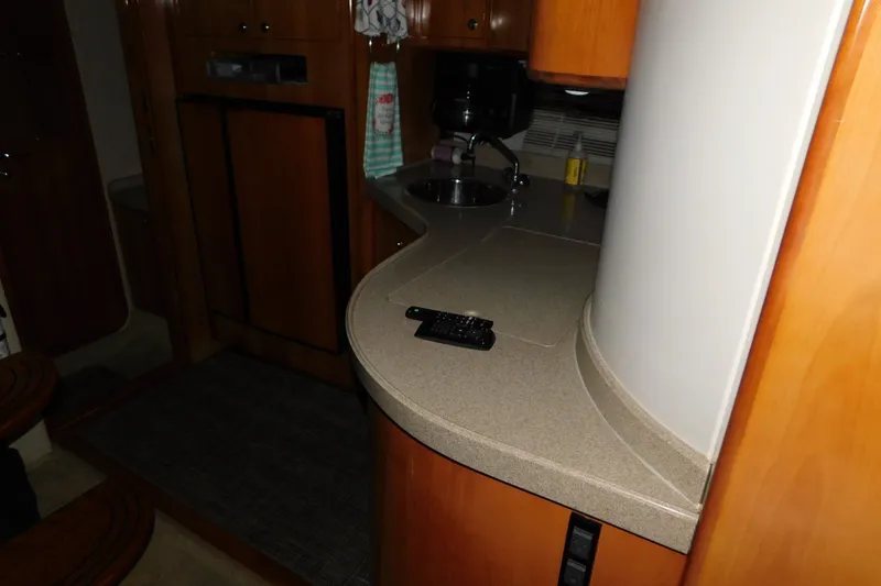 Slide: The Image of 2004 Regal Commodore 3860 yacht interior with kitchenette and countertop. - 75