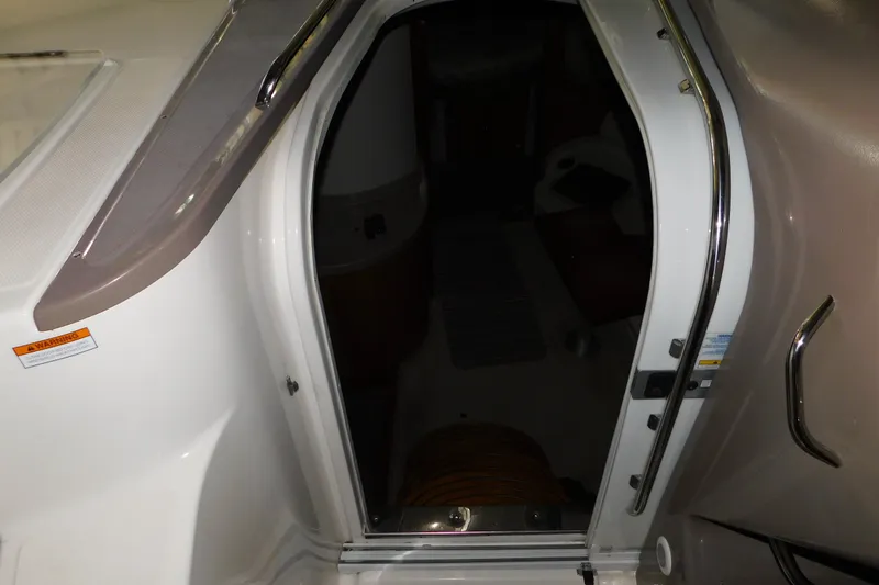 Slide: The Image of 2004 Regal Commodore 3860 cabin entrance with open door and visible interior. - 51