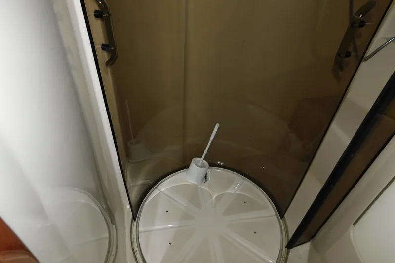Slide: The Image of Shower area inside 2004 Regal Commodore 3860 yacht with glass doors and brush. - 70