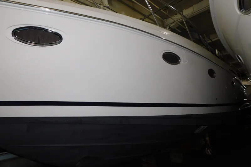 Slide: The Image of 2004 Regal Commodore 3860 yacht side view in indoor storage. - 11