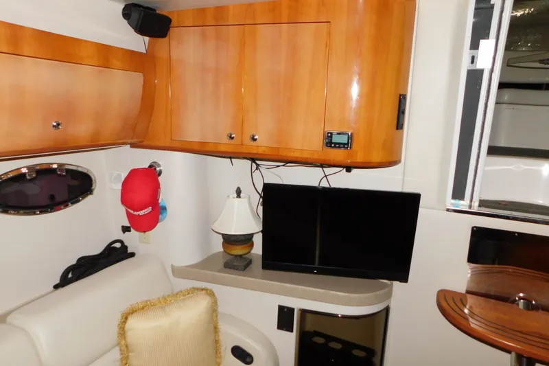 Slide: The Image of Interior of 2004 Regal Commodore 3860 yacht with wooden cabinets and modern amenities. - 55