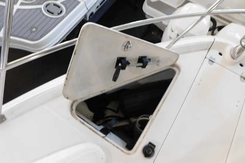Slide: The Image of Open storage compartment on a 2004 Regal Commodore 3860 boat deck. - 106