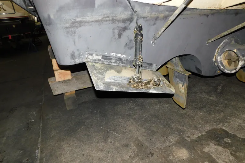 Slide: The Image of 2004 Regal Commodore 3860 boat hull with trim tab and propeller detail. - 112