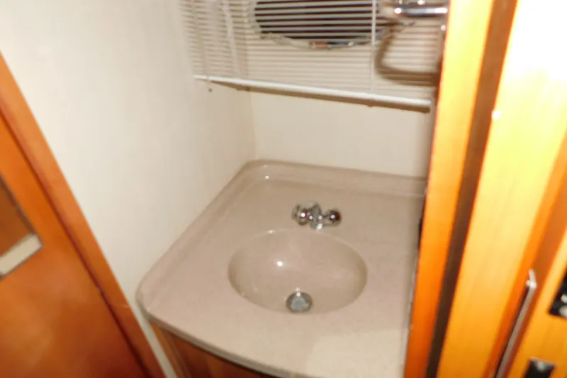 Slide: The Image of Small bathroom sink in 2004 Regal Commodore 3860 yacht interior. - 87