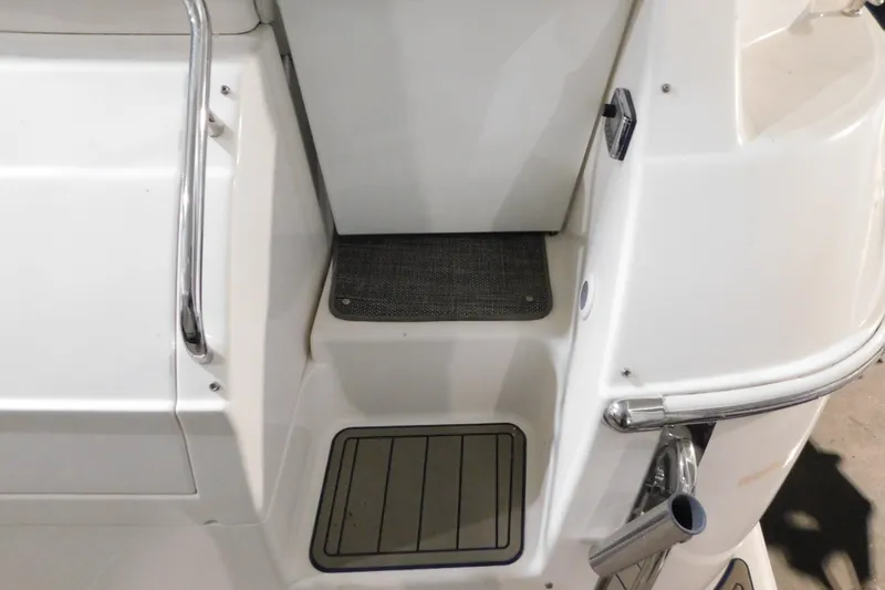 Slide: The Image of 2004 Regal Commodore 3860 boat deck with stainless steel railing and non-slip mat. - 20