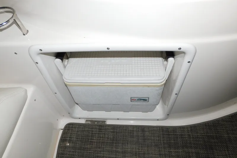 Slide: The Image of Built-in cooler compartment on a 2004 Regal Commodore 3860 boat interior. - 27