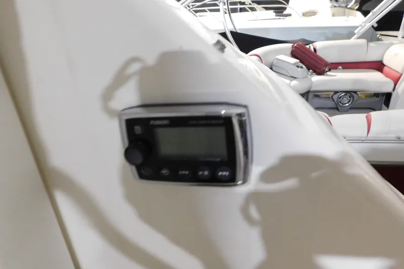 Slide: The Image of 2004 Regal Commodore 3860 boat interior with Fusion audio control panel. - 21