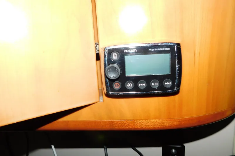 Slide: The Image of Fusion MS-NRX200i stereo on 2004 Regal Commodore 3860 yacht's wooden interior. - 57