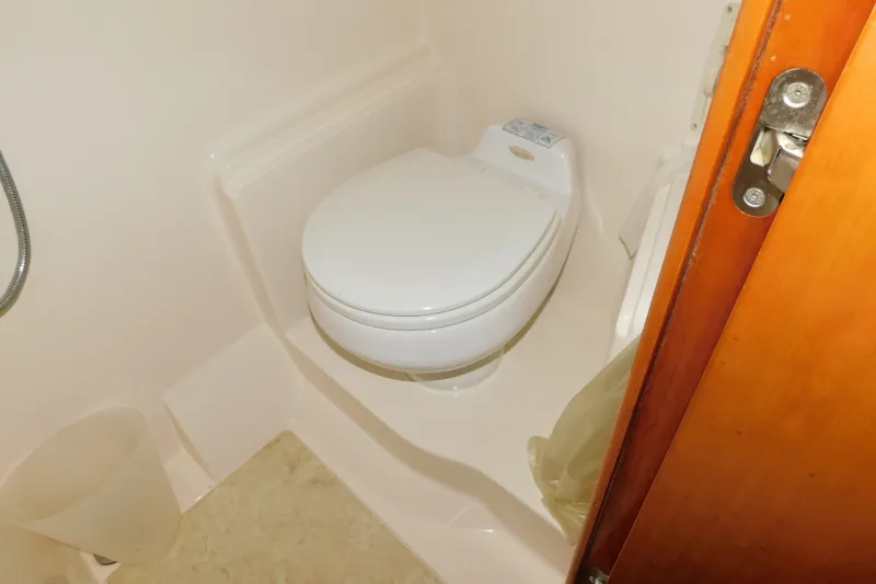 Slide: The Image of Toilet area in 2004 Regal Commodore 3860 yacht bathroom. - 94
