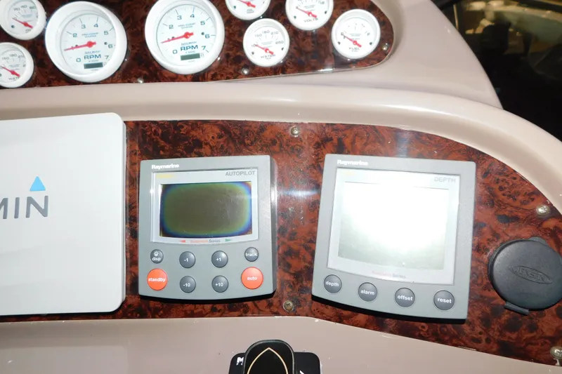 Slide: The Image of Dashboard of 2004 Regal Commodore 3860 with Raymarine autopilot and depth displays. - 45