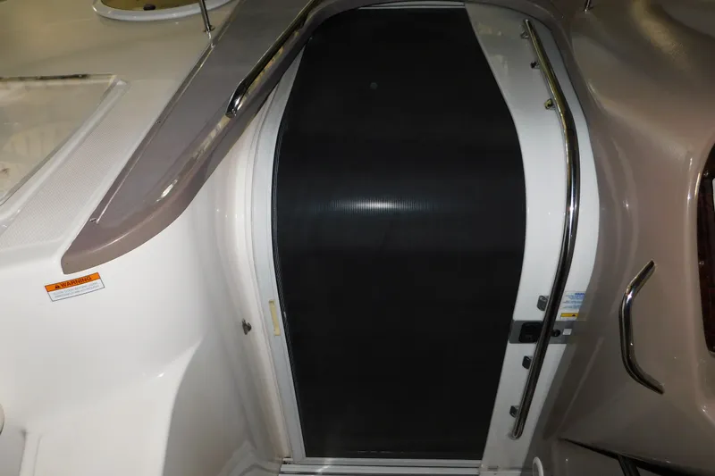 Slide: The Image of 2004 Regal Commodore 3860 boat cabin entrance with sleek design and stainless steel railings. - 50