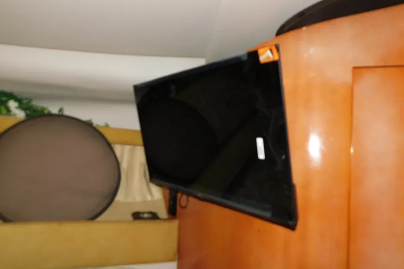 Slide: The Image of Flat-screen TV mounted inside 2004 Regal Commodore 3860 yacht interior. - 63