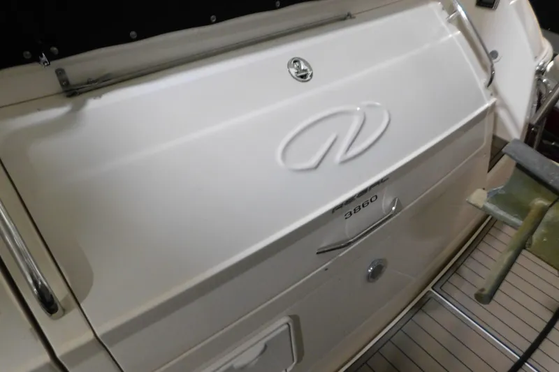 Slide: The Image of 2004 Regal Commodore 3860 boat stern with logo and model number. - 13