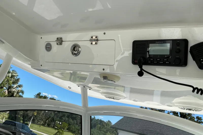 Slide: The Image of 2019 Sportsman Open 312 Center Console with Garmin radio and storage compartment. - 43