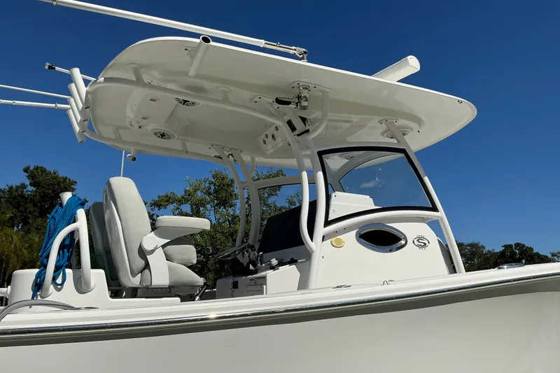 Slide: The Image of 2019 Sportsman Open 312 Center Console boat under clear blue sky. - 14