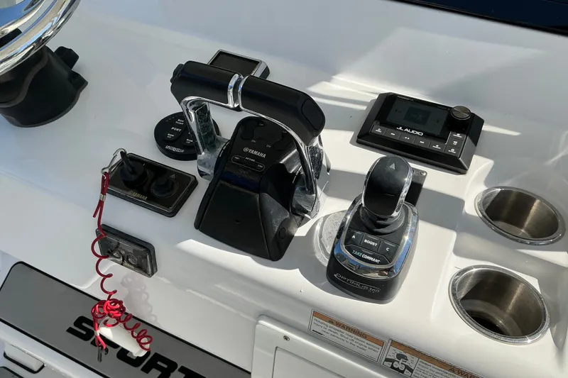 Slide: The Image of Control panel of a 2019 Sportsman Open 312 Center Console boat with Yamaha controls. - 50