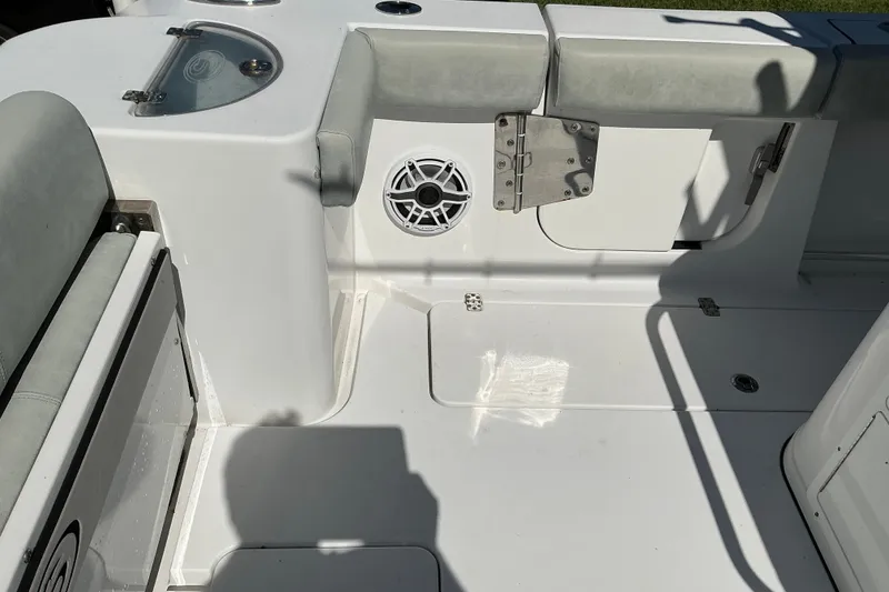 Slide: The Image of 2019 Sportsman Open 312 Center Console boat interior with seating and speaker. - 57