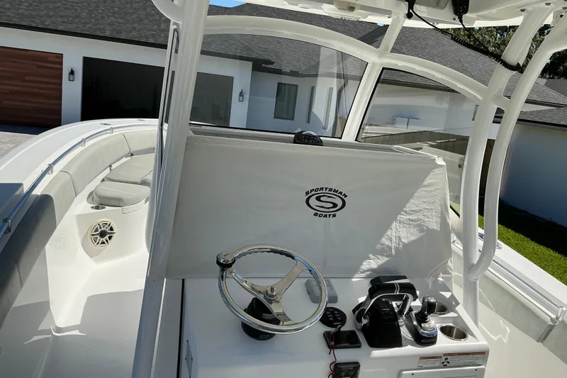 Slide: The Image of 2019 Sportsman Open 312 Center Console boat interior with steering wheel and seating. - 52