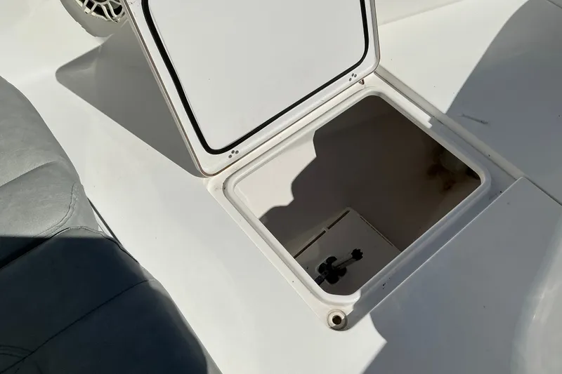 Slide: The Image of Open storage compartment on 2019 Sportsman Open 312 Center Console boat. - 32
