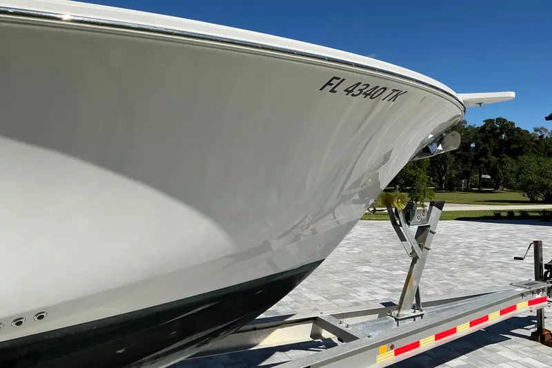 Slide: The Image of 2019 Sportsman Open 312 Center Console boat on trailer, sunny day. - 16