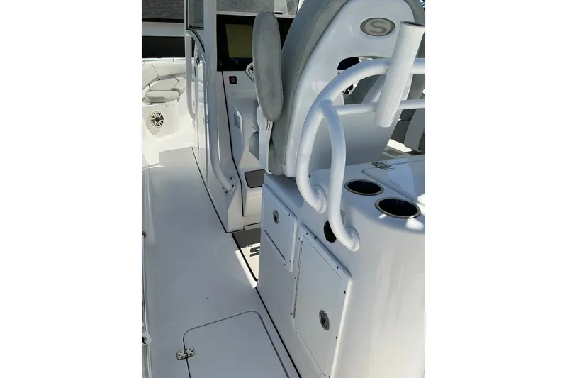 Slide: The Image of 2019 Sportsman Open 312 Center Console interior with seating and storage compartments. - 45