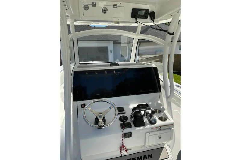 Slide: The Image of 2019 Sportsman Open 312 Center Console helm with steering wheel and controls. - 21