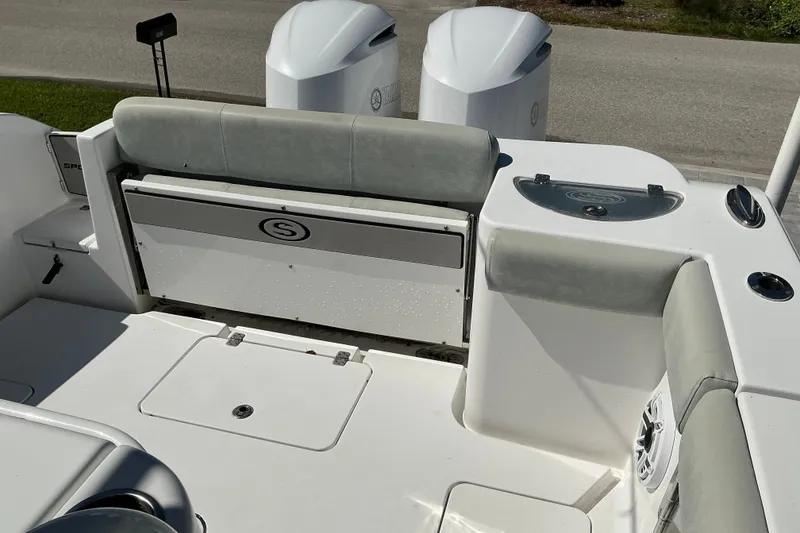 Slide: The Image of 2019 Sportsman Open 312 Center Console boat interior with seating and storage. - 54